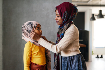 Wall Mural - Portrait of traditional muslim mother with her girl child. People, family, religion concept