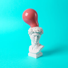 Wall Mural - Antique David bust with pink light bulb on turquoise background. Conceptual pop. Minimal still life. Creative idea