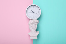David Bust With Clock On Pink Blue Background. Creative Layout. Concept Pop. Minimal Still Life. Flat Lay. Top View