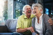 © Thurstan Hinrichsen/peopleimages.com - When youre laughing, youre living. Shot of a happy senior couple relaxing together on the sofa at home.