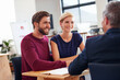 © D Laflor/peopleimages.com - Getting some expert advice. Young couple discussing investment plans with a financial advisor.