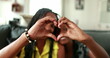 © Marco - Mixed race mother and teen daughter making heart symbol with hands