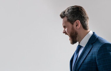 Profile portrait of angry professional man shouting grey background copy space, screaming