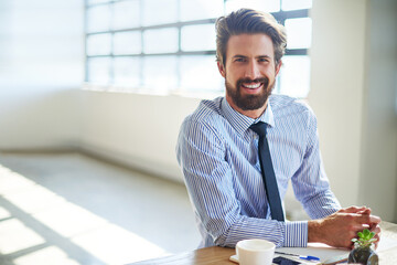 Aufkleber - I was born for success. Cropped portrait of a young businessman sitting in his office.