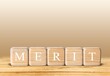 © BillionPhotos.com - Wooden blocks for 'MERIT' text of concept.