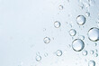 Leinwandbild Motiv champagne bubbles or cosmetic liquid water bubbles floats drops surface over a blurred background