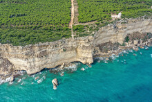 Aerial View Of Cliffs Along The Coastline With Turquoise Waters And A Watchtower, Torre Del Tajo, Barbate, Spain.