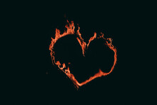 A Burning, Fiery Heart On A Black Background. A Figure In The Form Of A Heart With Fire