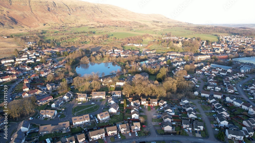 Arncroach Low level aerial image of a Scottish village and glen surrounded by ...