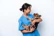© luismolinero - Young veterinarian woman with dog isolated on white background with happy expression