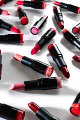 Lipsticks close up over white background