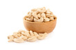 Cashew nut in wooden bowl on white background.