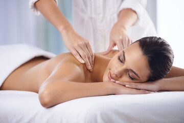 It doesnt get anymore relaxing.... Cropped shot of a beautiful young woman relaxing during spa treatment.