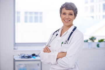 Poster - Her medical practice is well organised. Shot of a female doctor standing in a room with her arms crossed.