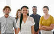 © Nicola Katie/peopleimages.com - Theyre a dedicated team. Cropped portrait of a diverse group of young colleagues standing in a brightly lit office.