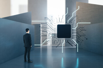 Aufkleber - Attractive european businessman standing in concrete interior with abstract micro chip and mock up place. AI and technology concept.