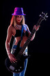 © Giulio_Fornasar - Sexy young female guitarist in chic trendy outfit on stage