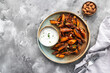 Honey garlic butter roasted carrots on a concrete background. Roasted carrots prepared with garlic butter and sweet honey sauce. Homemade glazed carrots