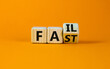 © Dzmitry - Fail fast symbol. Turned a wooden cube with concept words Fail fast on beautiful orange table orange background, copy space. Business and fail fast concept.