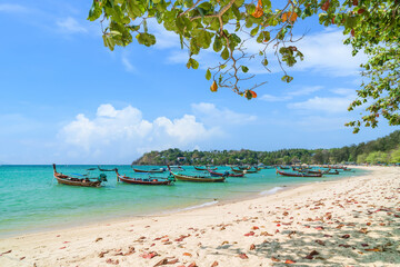 Wall Mural - wooden traditional boat at rawai beach with crystal clear water, famous tourist destination and reso