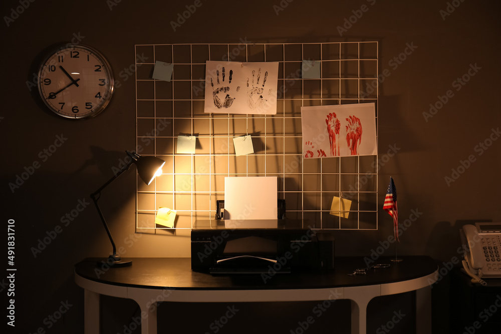 Interior of modern FBI agent's office at night
