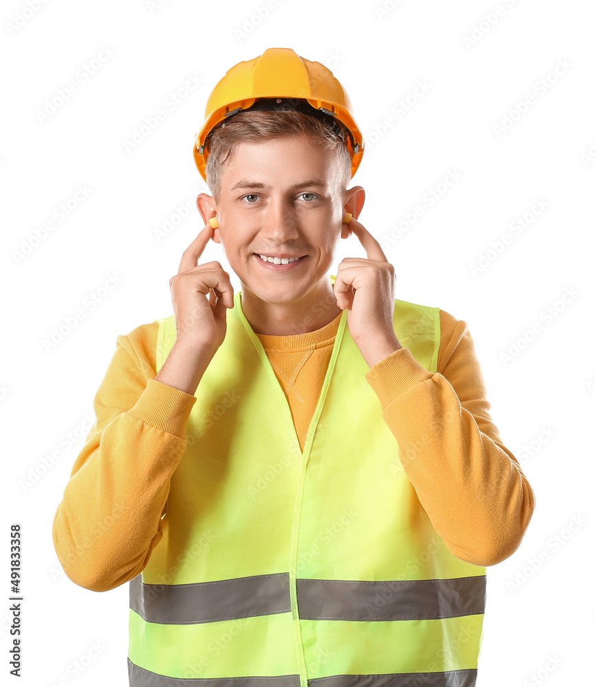 Male builder with earplugs on white background