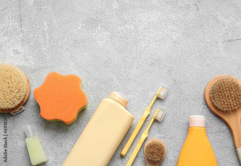 Set of bath accessories and cosmetic products on light background