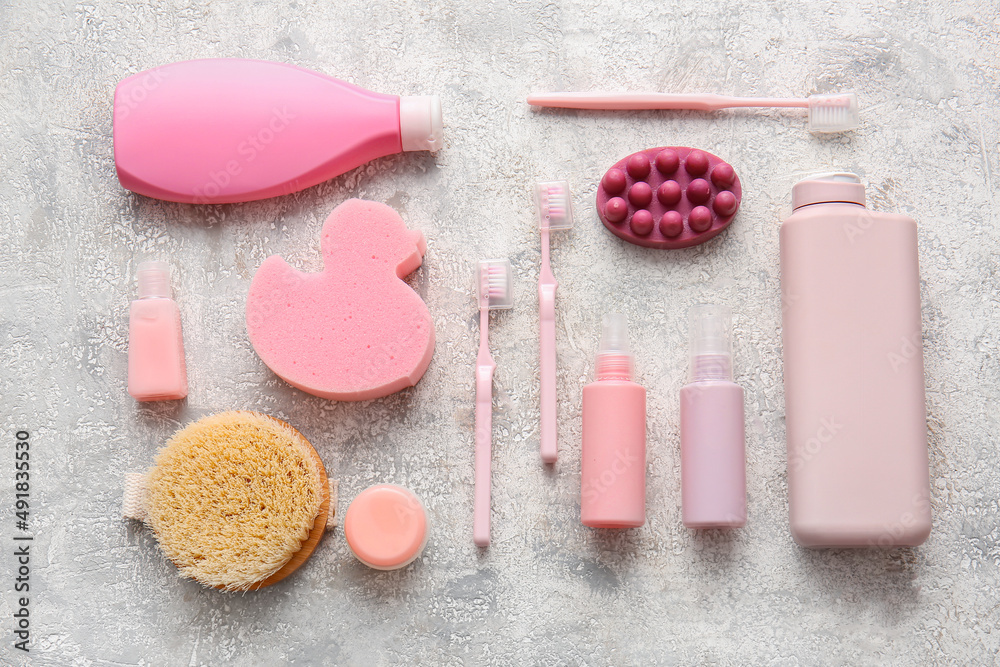 Composition with bath accessories and cosmetic products on grunge background