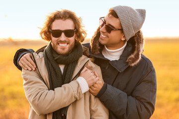 Canvas Print - Happy gay couple in autumn field