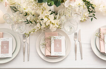 Stylish Table Setting With Wedding Invitations And Gypsophila Flowers, Top View