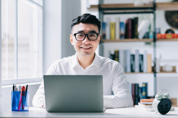 Sticker - Young Asian businessman working at office