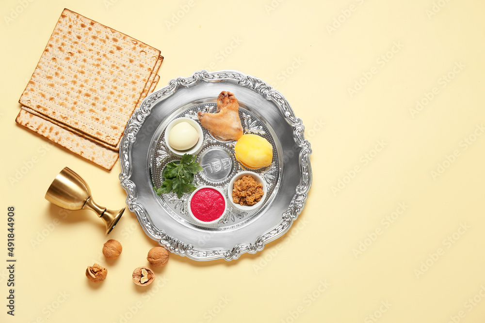 Passover Seder plate with traditional food on light background, top view