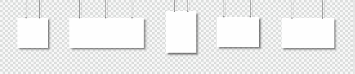 Poster - Template of white blank vector posters. Set of mockups hanging on the wall. Frame for paper sheet. Isolated on gray background. Vector illustration