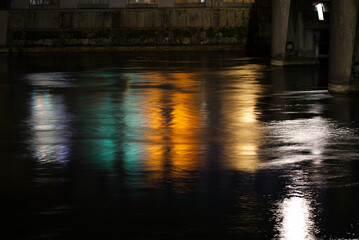 Wall Mural - Cafe named City Hall at the old town of Zürich by night with river Limmat in the foreground and beautiful reflections in water, defocus foreground. Photo taken Februar 24th, 2022, Zurich, Switzerland.