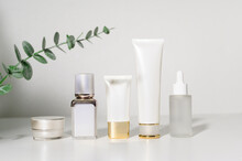 Moisturizing Cream Bottle Over Leaf Background Studio, Packing And Skincare Beauty Concept