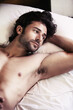 © Nicola K/peopleimages.com - Another lonely night. Handsome young man lying awake and thinking while in bed.