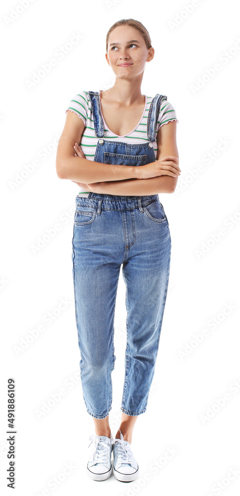 Young woman in denim jumpsuit on white background