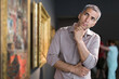 © JackF - Adult male is visiting at the pictures exposition in the museum.