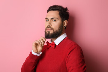 Wall Mural - Stylish bearded man on pink background