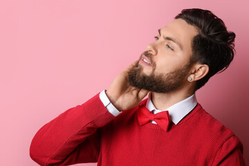 Wall Mural - Stylish bearded man on pink background