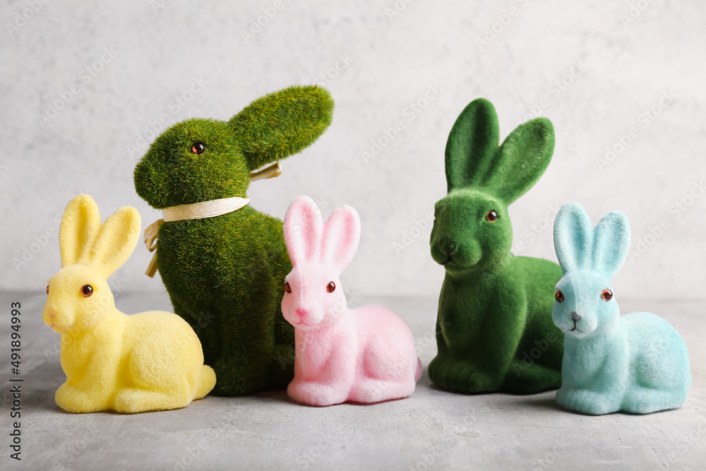 Cute soft Easter bunnies on light background