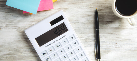 Poster - Calculator with papers and cup of coffee