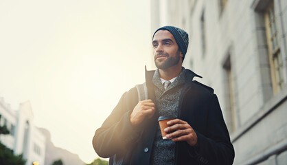 Wall Mural - Theres so much to see in the city. Shot of a fashionable young man out in the city.