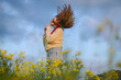 © Cavan Images - Portrait of confident young woman  in field