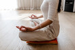 © Cavan Images - Asian woman exercising and sitting in yoga lotus position