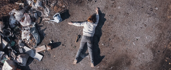 dead body the corpse of a teenage girl found using a drone in a landfill aerial survey to search for the missing