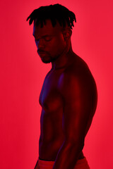 Poster - A healthy body is worth the effort. Red filtered shot of a young sportsman posing in the studio.