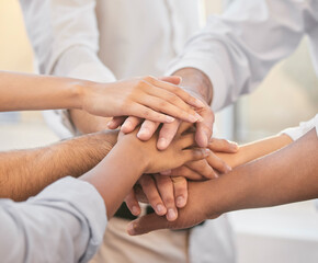 Poster - On three. Cropped shot of an unrecognizable group of businesspeople huddled together in the office and piling their hands in the middle.