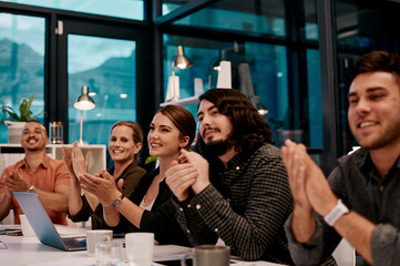 Aufkleber - What a great presentation. Shot of a group of businesspeople applauding while sitting in the boardroom.