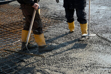 Construction Workers. Concrete Construction. Boots